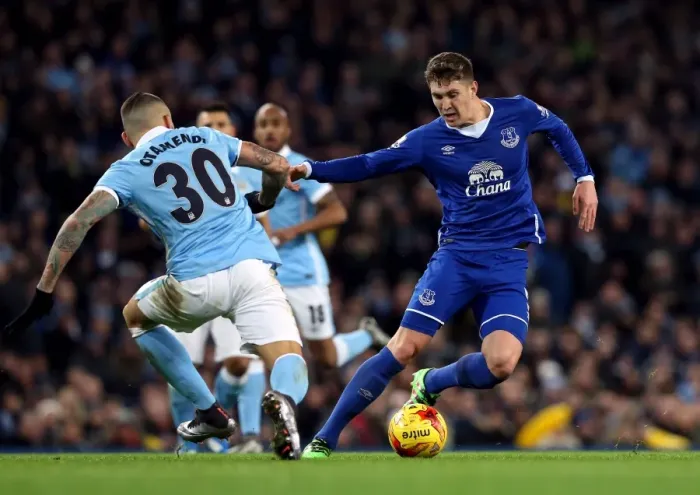 Framed Print : Otamendi vs. Stones: A Riveting Clash in the Capital One Cup Semi-Final Framed Print : Otamendi vs. Stones: A Riveting Clash in the Capital One Cup Semi-Final