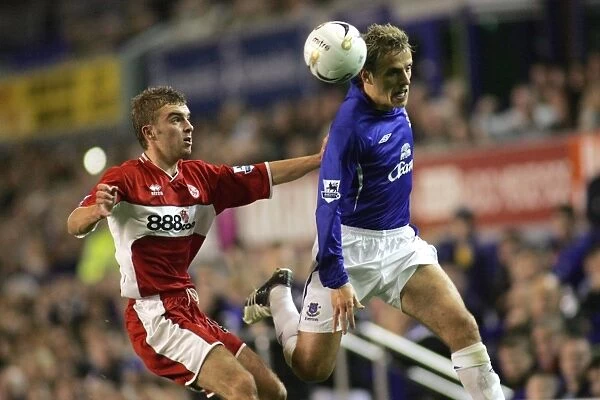 Phil Neville gets his head to the ball