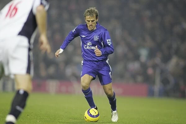 Phil Neville moves forward with the ball