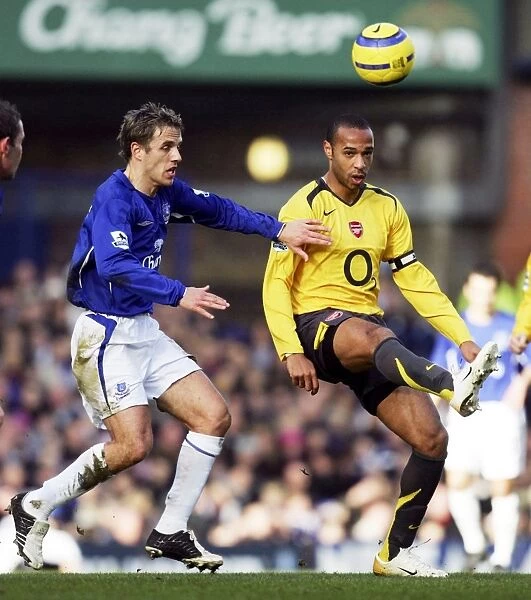 Phil Neville pays close attention to Thierry Henry Mandatory Credit