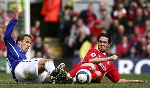 Phil Neville. Philip Neville gets a strong tackle in on Luis Garcia Mandatory Credit