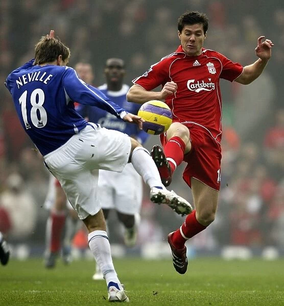 Phil Neville tackles Xabi Alonso