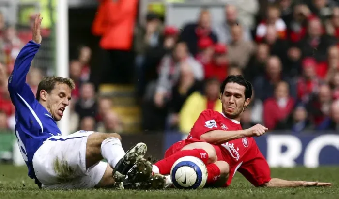 Framed Print : Phil Neville vs Luis Garcia: Intense Tackle on the Football Field Framed Print : Phil Neville vs Luis Garcia: Intense Tackle on the Football Field