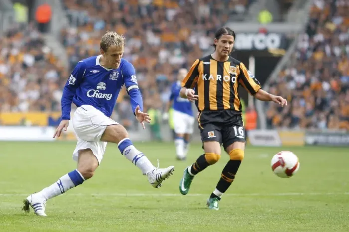 Framed Print : Phil Neville's Determined Shot Against Hull City in the Barclays Premier League, 2008
