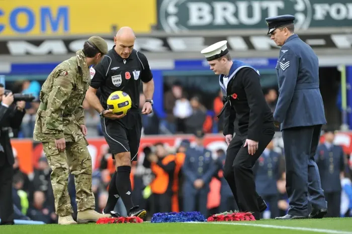 Framed Print : Remembrance Sunday at Goodison Park: Everton and Arsenal Players Honor Fallen Heroes Before Premier League Match (14 November 2010)