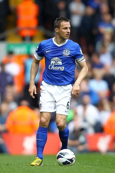 Rivalry Unyielding: Phil Jagielka's Defiant Stand in the 0-0 Liverpool vs. Everton Battle at Anfield (May 5, 2013)