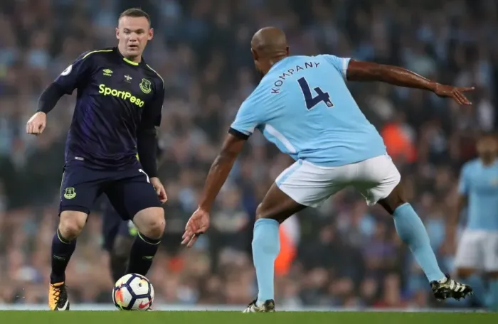 Framed Print : Rooney vs. Kompany: Intense Battle for Ball at Etihad Stadium - Manchester City vs. Everton, Premier League Framed Print : Rooney vs. Kompany: Intense Battle for Ball at Etihad Stadium - Manchester City vs. Everton, Premier League