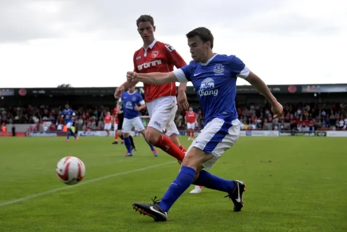 Framed Print : Seamus Coleman vs. Gary McDonald: Intense Clash between Everton's Star and Morecambe's Star Player during Pre-Season Friendly