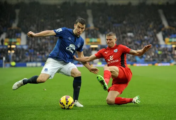 Framed Print : Seamus Coleman vs. Paul Konchesky: A Premier League Slide Tackle Showdown at Goodison Park