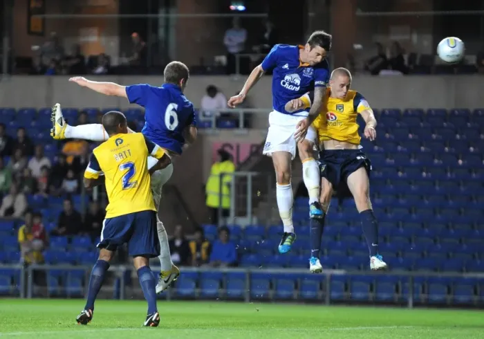 Framed Print : Shane Duffy's Determined Header: Everton's Pre-Season Showdown at Oxford United (2011) Framed Print : Shane Duffy's Determined Header: Everton's Pre-Season Showdown at Oxford United (2011)
