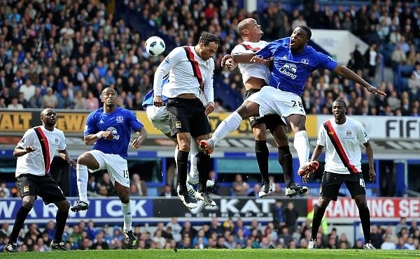 Soaring Anichebe: Everton vs Manchester City's Intense Aerial Battle (07 May 2011, Barclays Premier League)