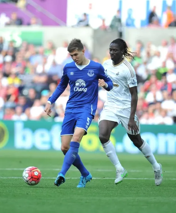 Framed Print : Swansea's Eder Clashes with Everton's John Stones in Intense Barclays Premier League Match Framed Print : Swansea's Eder Clashes with Everton's John Stones in Intense Barclays Premier League Match