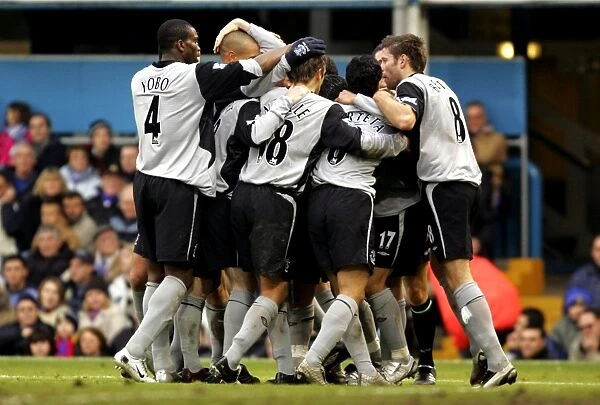 Team Celebration. Leon Osman is mobbed by his teammates