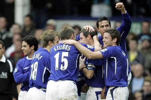 Team Celebration. David Weir celebrates scoring the first goal for Everton with Tim Cahill