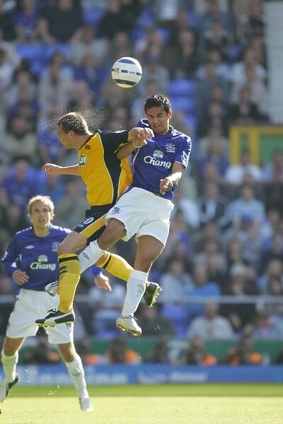 Tim Cahill soars high to win the header