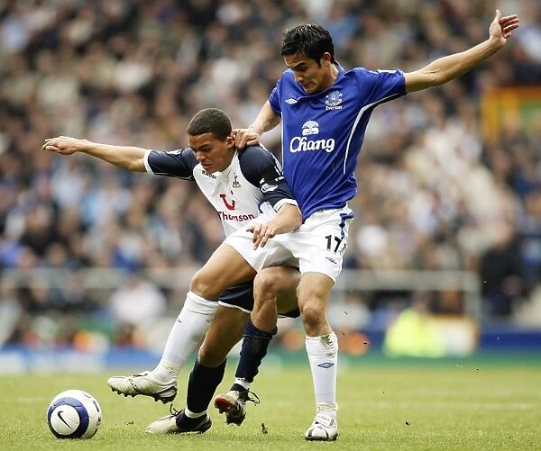 Tim Cahill and Jermaine Jenas of Spurs battle for the ball Mandatory Credit