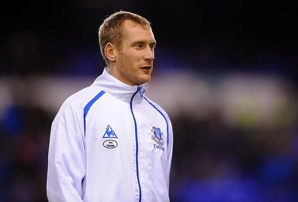 Tony Hibbert's Unyielding Spirit: Everton's Defender in Determined Fifth Round FA Cup Battle vs. Reading at Goodison Park (01 March 2011)