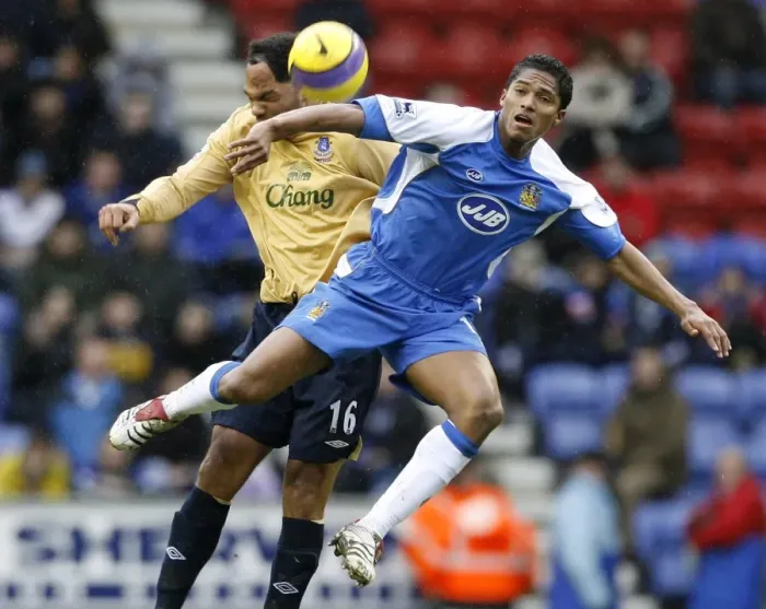 Framed Print : Wigan Athletics Valencia challenges Evertons Lescott for the ball during their English Premier Lea Framed Print : Wigan Athletics Valencia challenges Evertons Lescott for the ball during their English Premier Lea