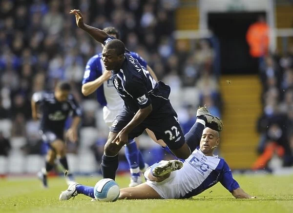 Yakubu vs. Nafti: Intense Battle between Everton's Yakubu and Birmingham City's Mehdi Nafti in the Barclays Premier League, December 4, 2008