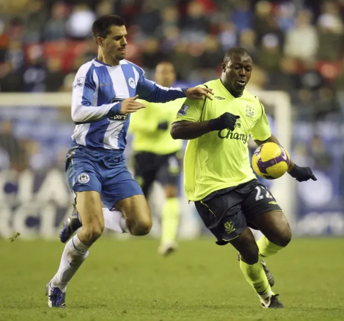 Framed Print : Yakubu vs. Scharner: Intense Clash Between Wigan and Everton in Barclays Premier League Framed Print : Yakubu vs. Scharner: Intense Clash Between Wigan and Everton in Barclays Premier League