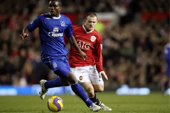Framed Print : Yobo vs Rooney: Everton vs Manchester United Clash at Old Trafford, 2006 Framed Print : Yobo vs Rooney: Everton vs Manchester United Clash at Old Trafford, 2006