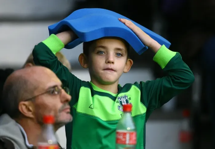 Framed Print : Young Everton Fan's Thrill: Giant Foam Hand at Goodison Park during Everton vs Stoke City (Premier League 2010)