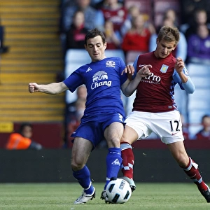 Baines vs Albrighton: A Football Showdown - Everton's Leighton Baines and Aston Villa's Marc Albrighton Clash for Ball Possession