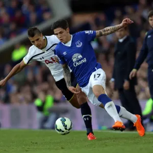 Battle for the Ball: Muhamed Besic vs. Erik Lamela - Everton vs. Tottenham Rivalry at Goodison Park Battle for the Ball: Muhamed Besic vs. Erik Lamela - Everton vs. Tottenham Rivalry at Goodison Park
