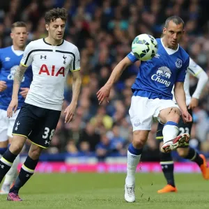 Battle for the Ball: Osman vs. Mason - Everton vs. Tottenham Hotspur, Premier League Rivalry Battle for the Ball: Osman vs. Mason - Everton vs. Tottenham Hotspur, Premier League Rivalry
