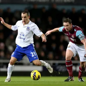 Battle for the Ball: Osman's Triumph over Nolan in Everton's 2-1 Victory (BPL 2012)