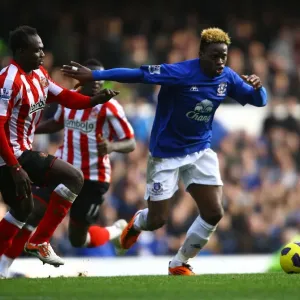 Battle for the Ball: Saha vs Mensah - Everton vs Sunderland's Intense Rivalry (Barclays Premier League, 26 February 2011) Battle for the Ball: Saha vs Mensah - Everton vs Sunderland's Intense Rivalry (Barclays Premier League, 26 February 2011)