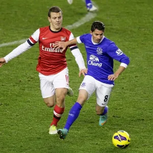 Battle for the Ball: Wilshere vs. Oviedo - Everton vs. Arsenal Rivalry in the Premier League (1-1)