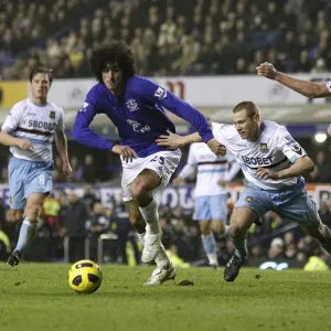 Battle at Goodison Park: Fellaini's Intense Clash with Upson and Spector (Everton vs West Ham Premier League, January 2011) Battle at Goodison Park: Fellaini's Intense Clash with Upson and Spector (Everton vs West Ham Premier League, January 2011)