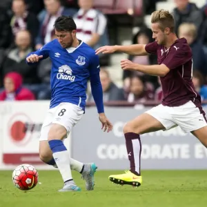 Battling for the Ball: Oviedo vs McGhee - Pre-Season Clash at Tynecastle Stadium Battling for the Ball: Oviedo vs McGhee - Pre-Season Clash at Tynecastle Stadium