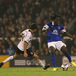 Battling for Control: Lukaku vs. Karagounis in the Capital One Cup Showdown at Craven Cottage