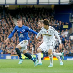 Battling Midfielders: Ross Barkley vs. Ki Sung-Yeung at Goodison Park - Everton vs. Swansea City, Premier League Battling Midfielders: Ross Barkley vs. Ki Sung-Yeung at Goodison Park - Everton vs. Swansea City, Premier League