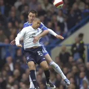 Chelsea v Everton - John Terry and James Vaughan battle for the ball Chelsea v Everton - John Terry and James Vaughan battle for the ball