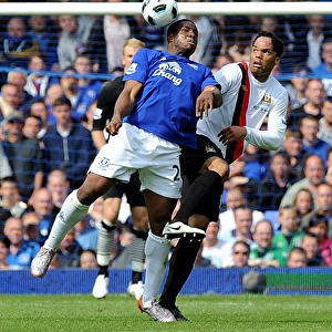 Clash at Goodison Park: Anichebe vs. Lescott - A Premier League Showdown (Everton vs. Manchester City, May 2011)