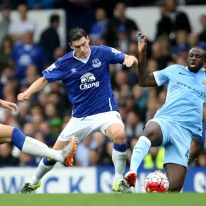 Print of Yaya Toure challenging Gareth Barry at Goodison Park Print of Yaya Toure challenging Gareth Barry at Goodison Park