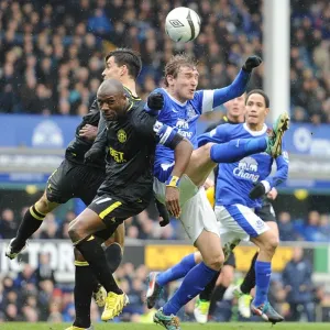 Clash in the Quarter-Finals: Jelavic vs. Boyce and Scharner - Everton vs. Wigan Football Rivalry