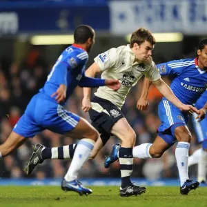 Clash at Stamford Bridge: Seamus Coleman Stands Firm Against Chelsea's Ashley Cole and Florent Malouda Clash at Stamford Bridge: Seamus Coleman Stands Firm Against Chelsea's Ashley Cole and Florent Malouda