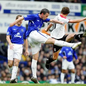 Print of David Weir vs. Brian McBride in an Everton FC match Print of David Weir vs. Brian McBride in an Everton FC match