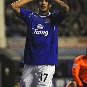 Dejected Tim Cahill: Everton's Agony Against Chelsea in the 08/09 Barclays Premier League