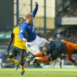 Determined Clash: Duncan Ferguson's Intense Challenge Against Wigan's Goalkeeper Determined Clash: Duncan Ferguson's Intense Challenge Against Wigan's Goalkeeper
