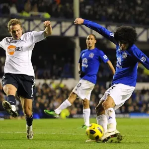 Determined Duel: Fellaini's Brave Shot Against Bolton Wanderers in Everton's Premier League Clash (10 November 2010) Determined Duel: Fellaini's Brave Shot Against Bolton Wanderers in Everton's Premier League Clash (10 November 2010)