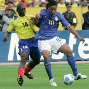 Ecuadors Castillo fights for the ball Brazils Ronaldinho during their World Cup qualifier soccer match in Quito