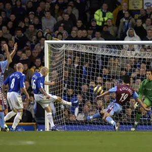 Everton v Aston Villa Lee Carsley - Everton shoots at goal under pressure from Liam Ridgewell