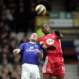 Everton v Blackburn Rovers Benni McCarthy and Lee Carsley in action
