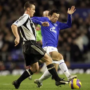 Everton v Newcastle United Simon Davies tackles Newcastles Scott Parker Everton v Newcastle United Simon Davies tackles Newcastles Scott Parker