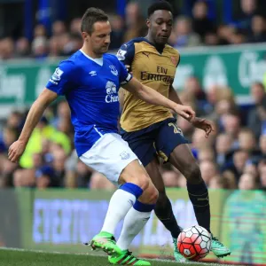 Everton vs Arsenal: Jagielka vs Welbeck - A Battle for the Ball in the Barclays Premier League at Goodison Park Everton vs Arsenal: Jagielka vs Welbeck - A Battle for the Ball in the Barclays Premier League at Goodison Park